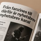 Närbild på ett fanzine med en handritad logotyp och text i punk-estetik.